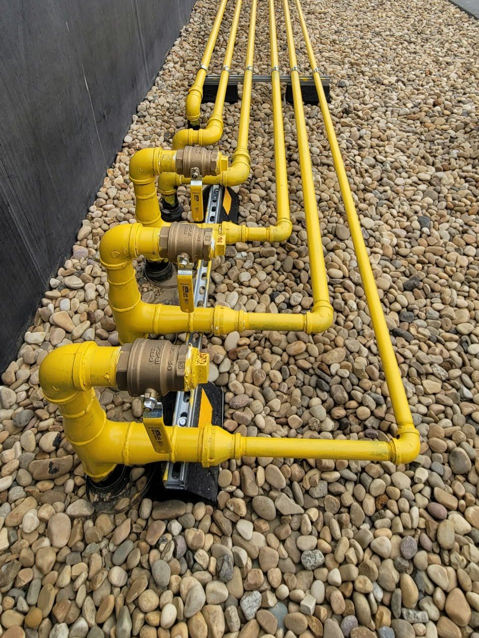 Rooftop gas piping and shut-off valves installed by RS Plumbing & Gas
